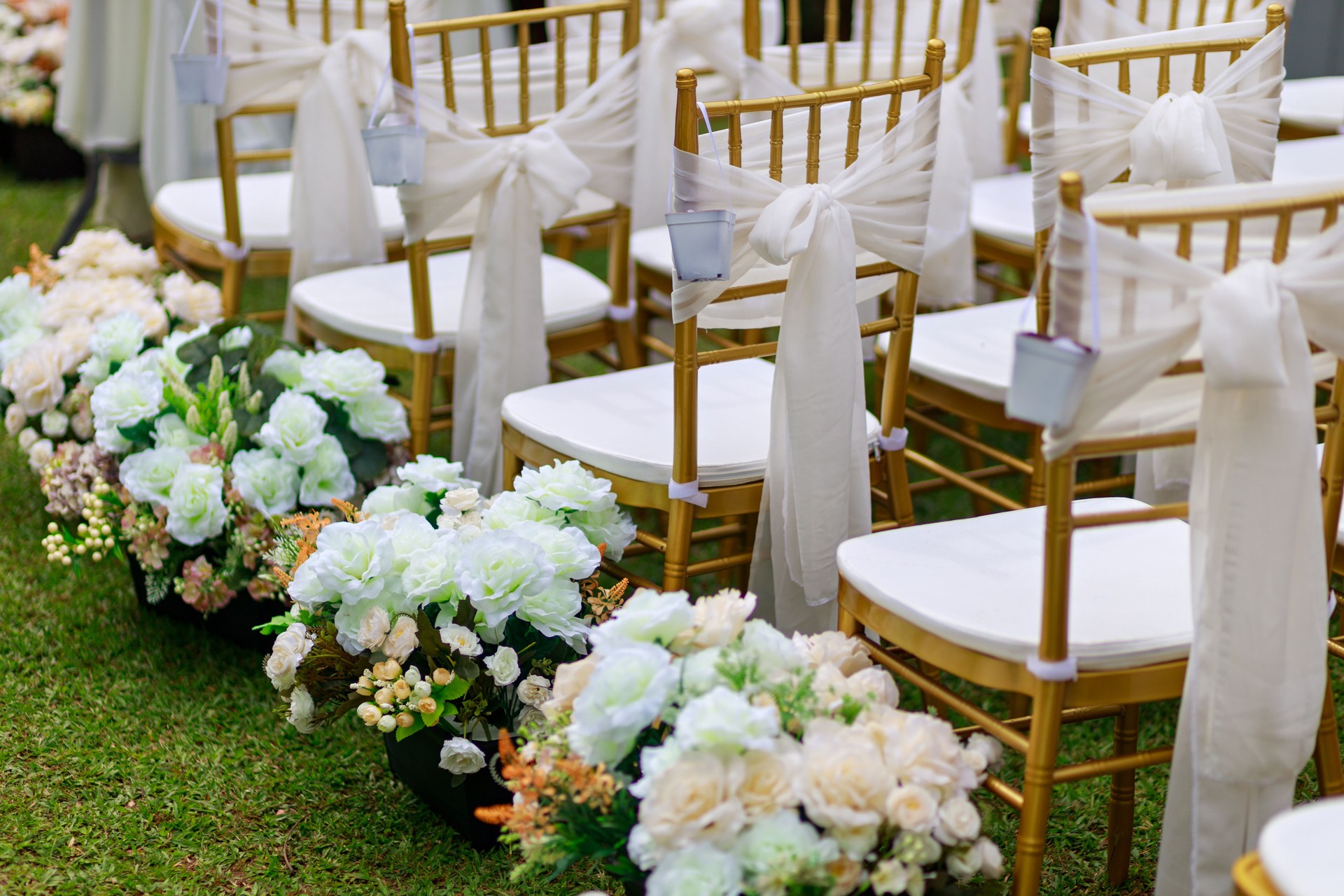 Golden chiavari chairs for outdoor garden wedding