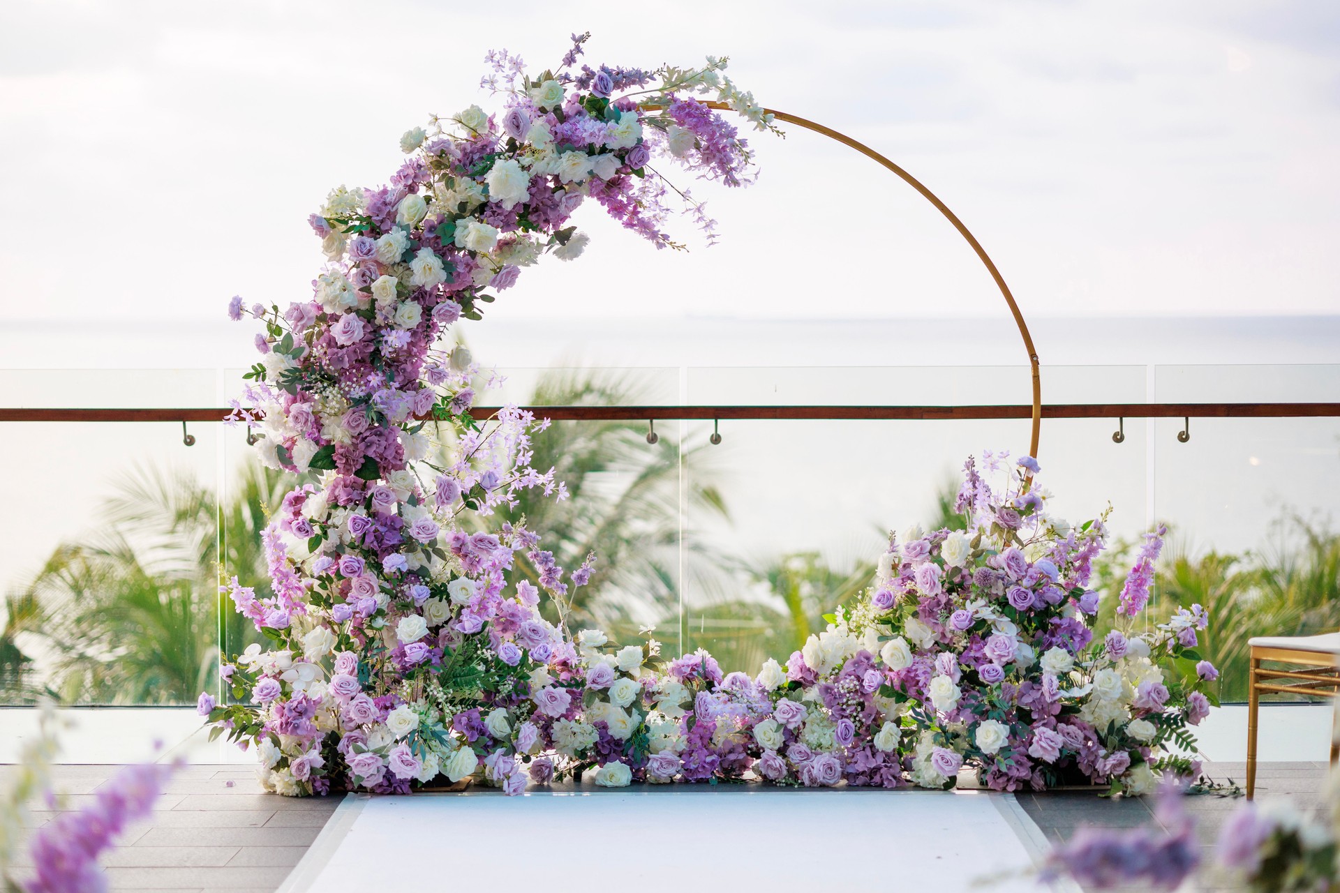 Beautiful wedding arch adorned with white and purple flowers